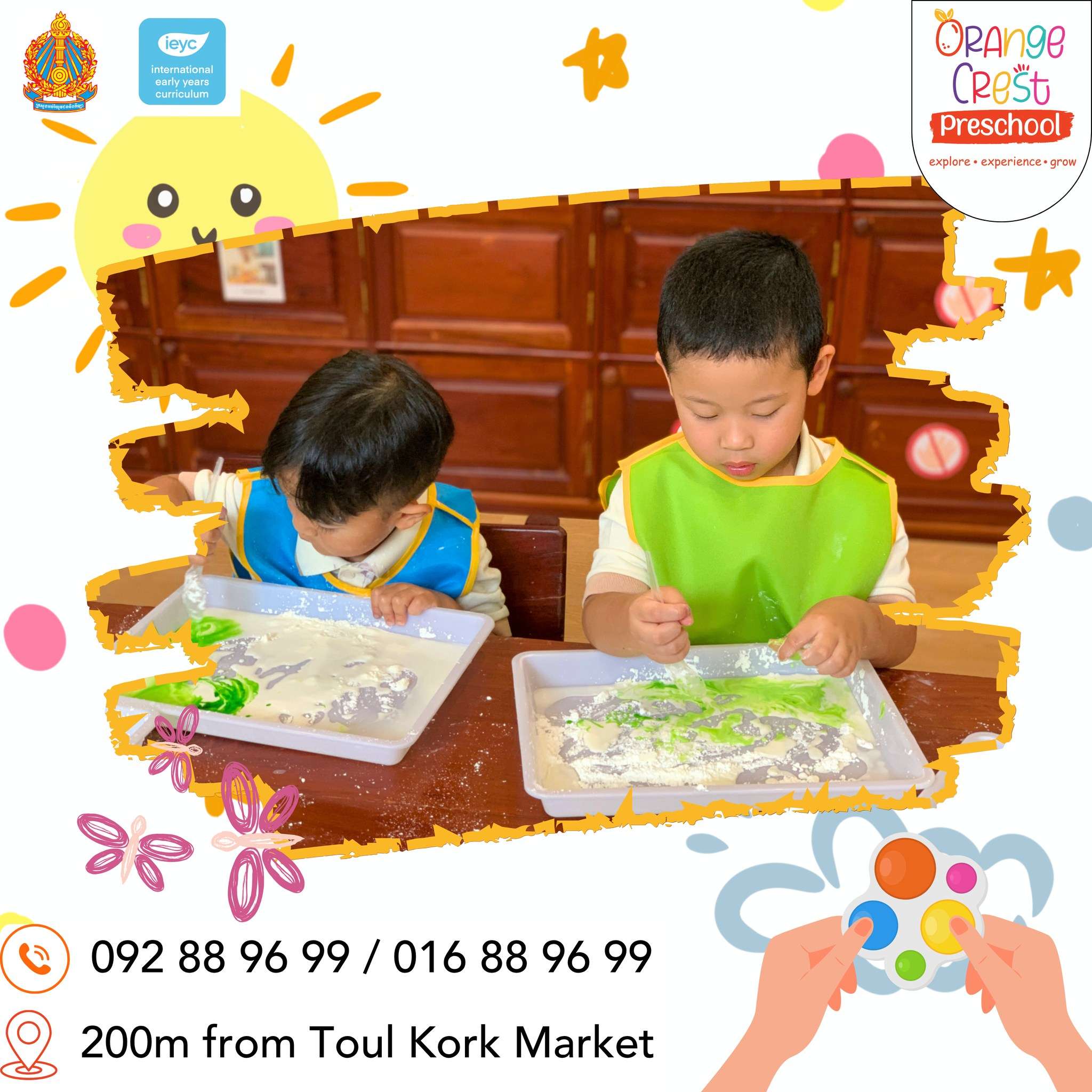 Two preschool children at Orange Crest Preschool engaged in Oobleck sensory play, using trays filled with a green and white squishy mixture to explore textures and movement.
