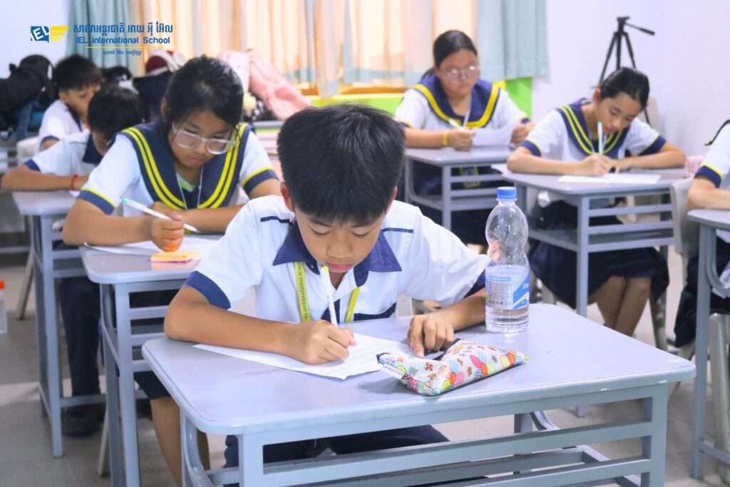Primary school students in a vibrant classroom setting at IEL International School