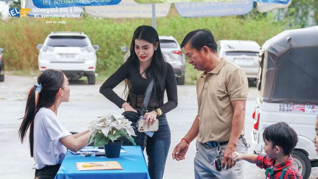 Teacher guiding secondary students during a library lesson at IEL International School