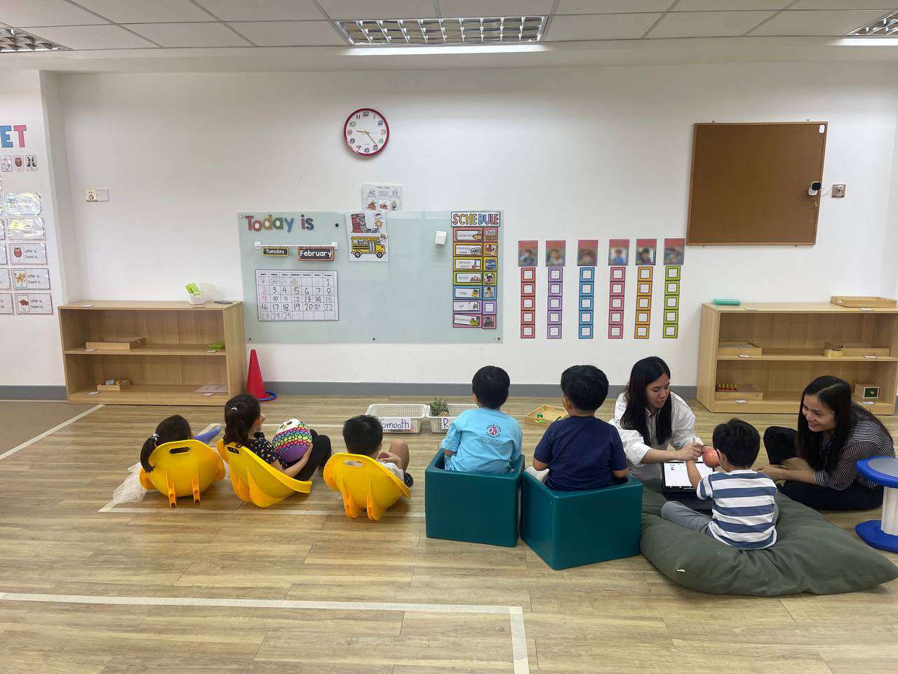 Preschool classroom at OrbRom Center with children engaged in structured group activities, supported by educators to promote early learning and social skills in Phnom Penh.