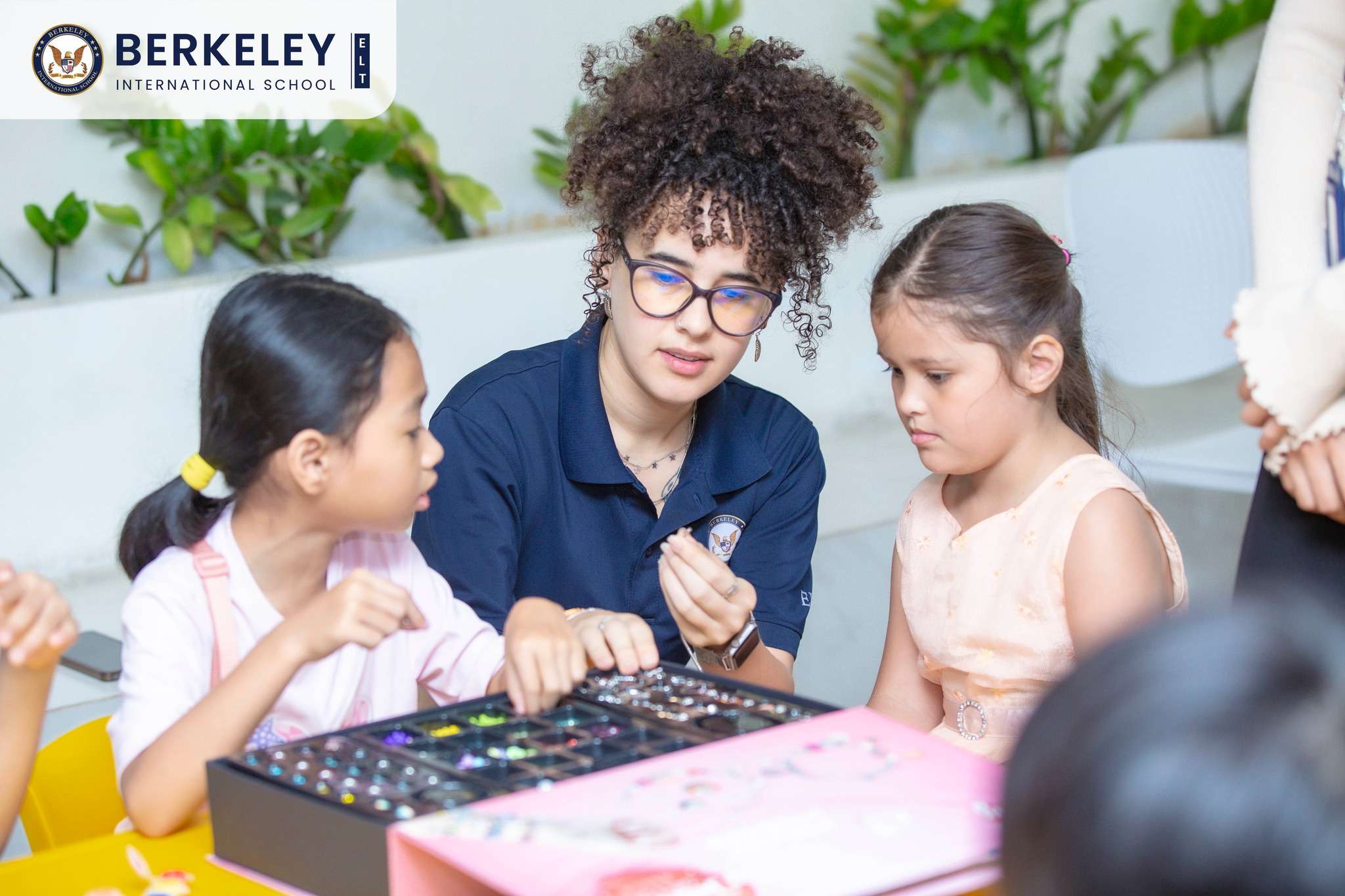 Students, teachers, and families engaging in hands-on activities at Berkeley International School’s Open House in Phnom Penh