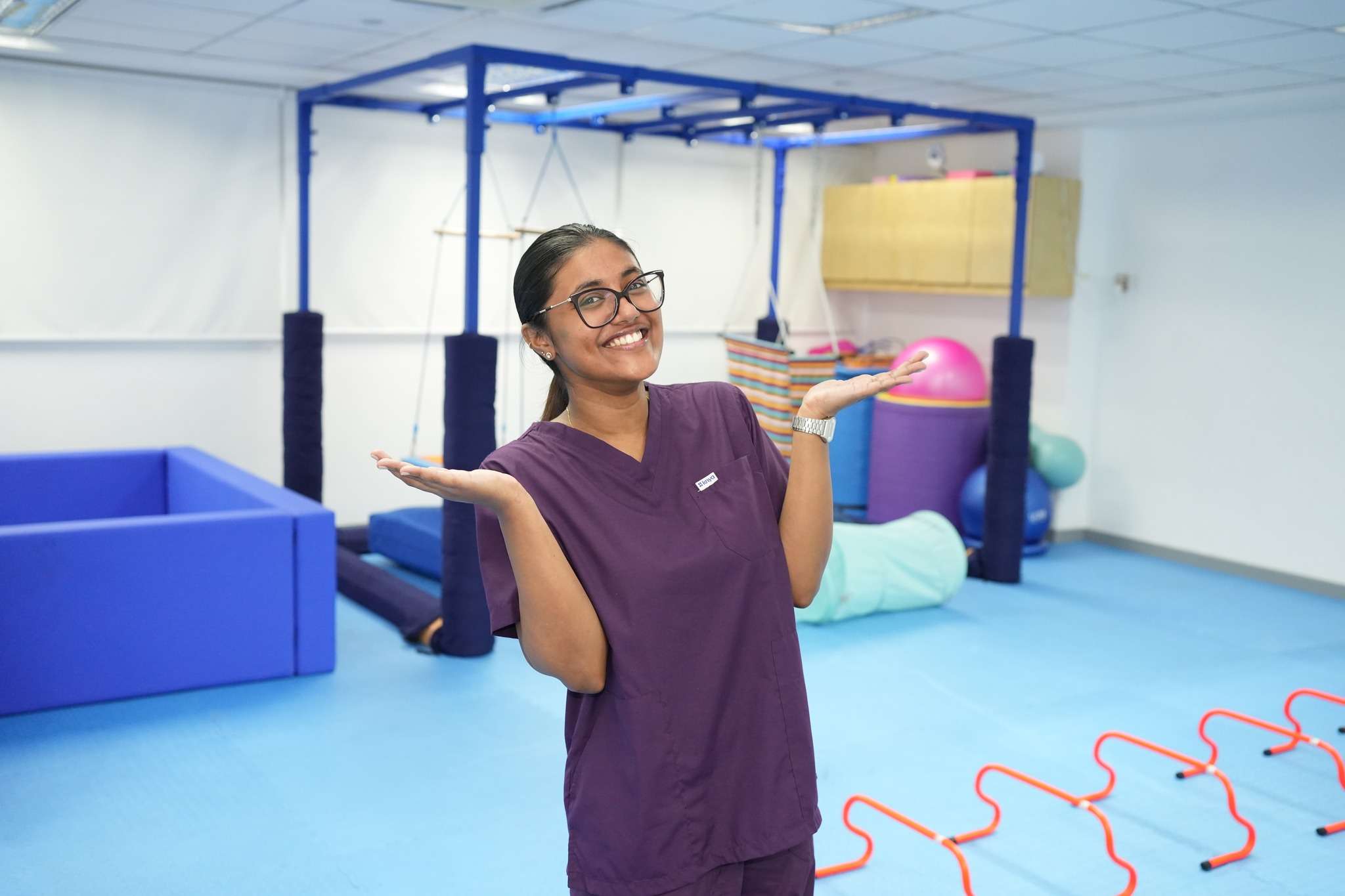 Occupational therapist smiling in sensory gym at OrbRom Center Phnom Penh Category: Occupational Therapy