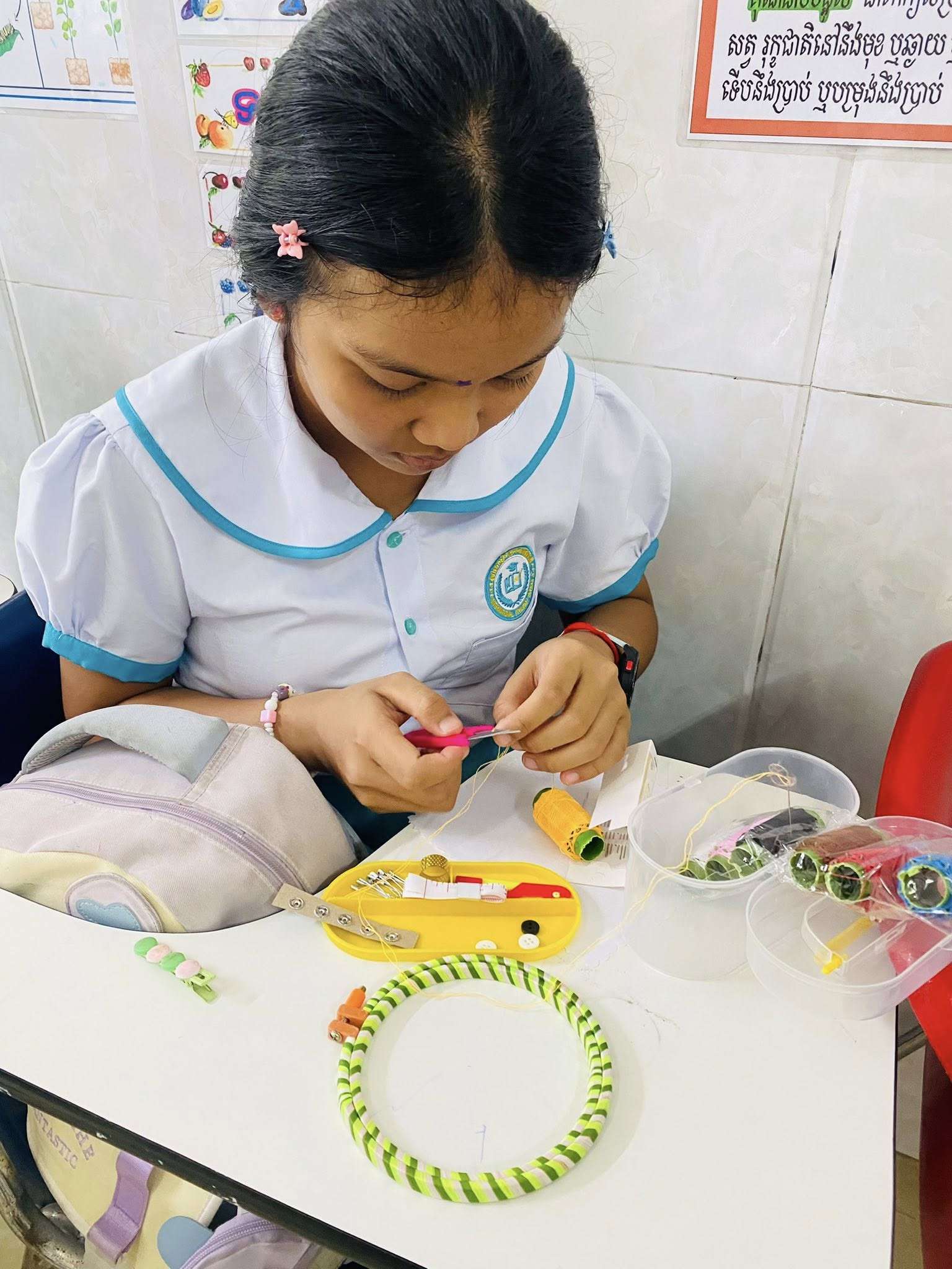Students at International Standard School participating in hands-on craft activities to develop creativity, fine motor skills, and focus during class.