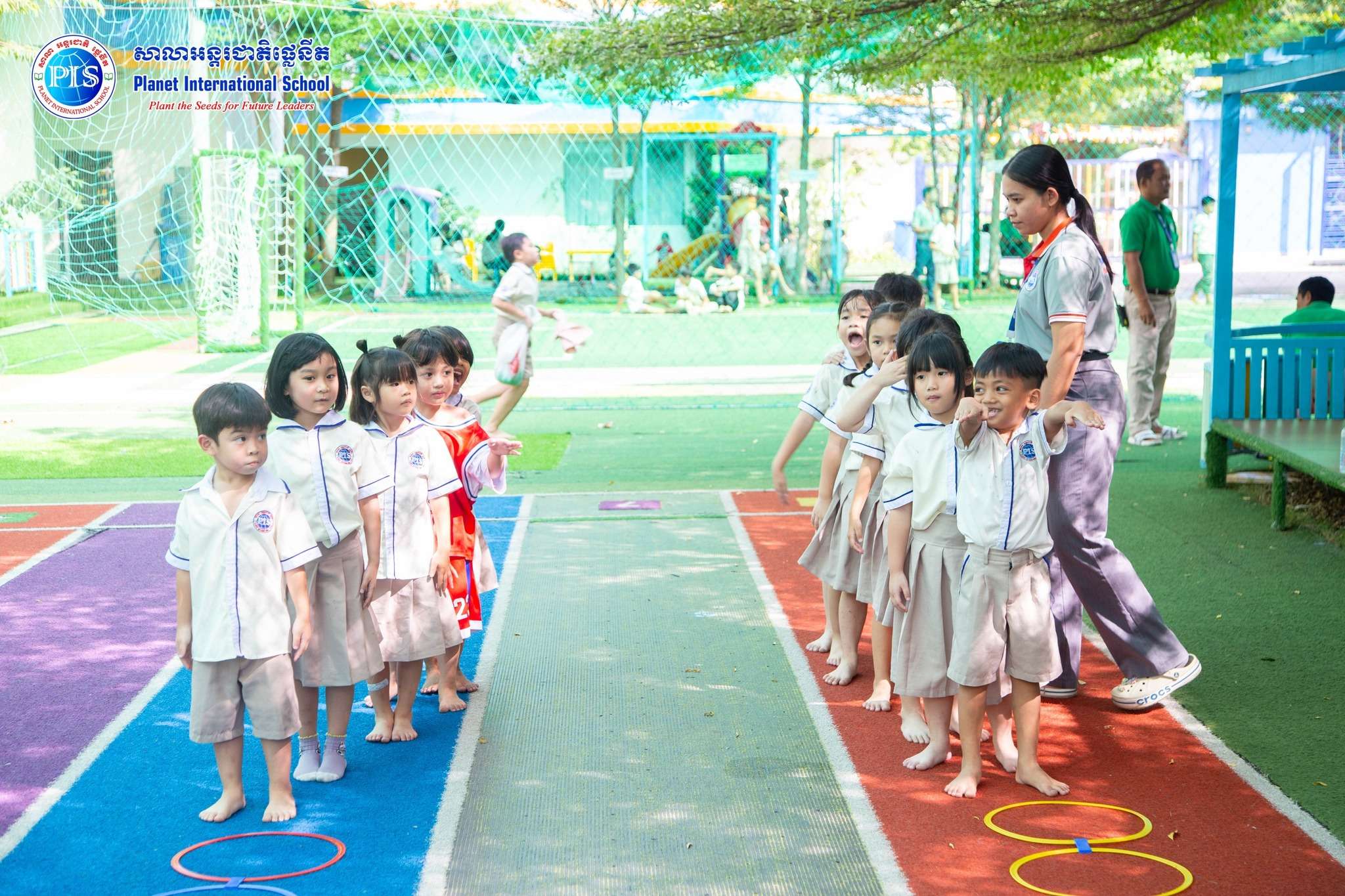 Students at Planet International School enjoying outdoor physical education and structured play in Phnom Penh
