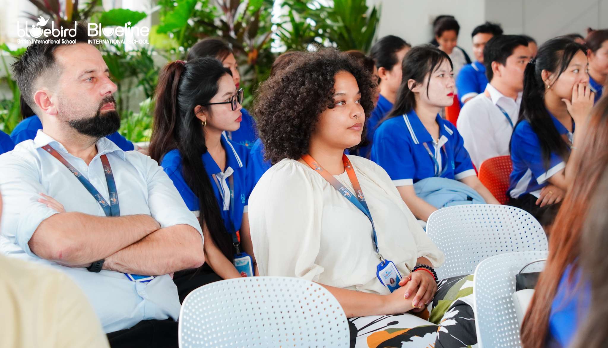 Professional development launch event at Bluebird British International School in Phnom Penh featuring staff and administrators in training and planning sessions.