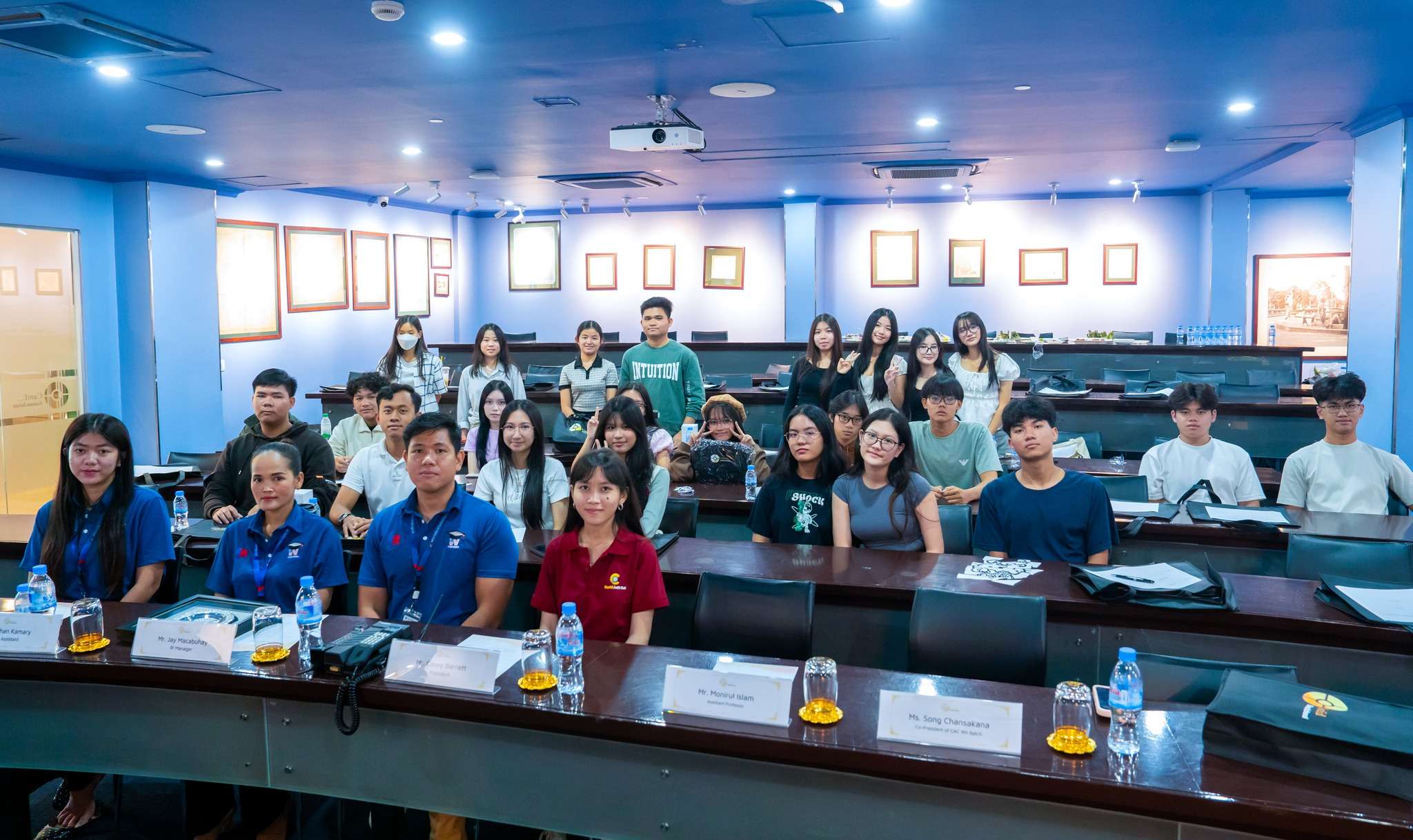 Photos of Western International School students visiting CamEd Business School, featuring group classroom activities, team presentations, and a school tour in front of the CamEd logo wall