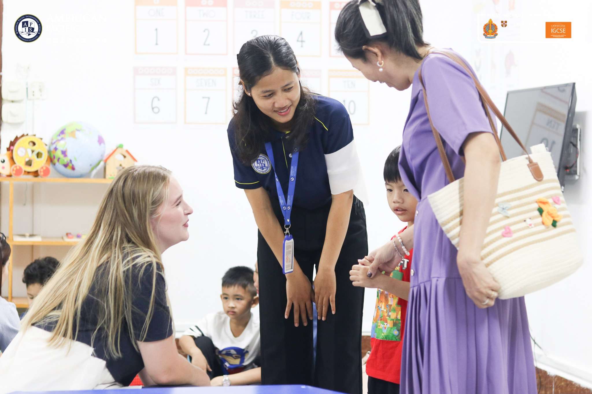 Families visiting classrooms and interacting with teachers at American Pacific International School, Pet Loksang Campus Open House