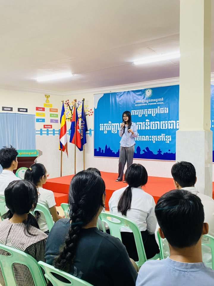 Level 12 student delivering speech at International Standard School event