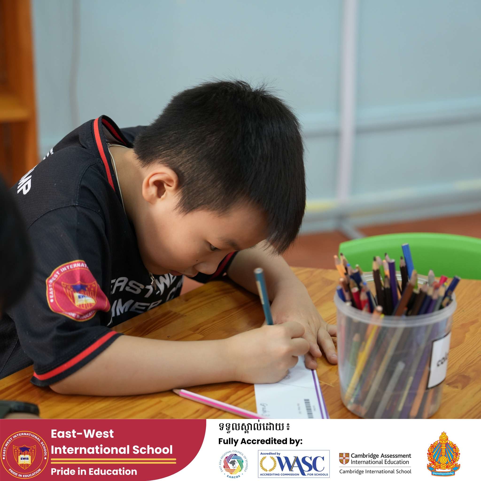 Students at East-West International School Cambodia engaging in Library Time, reading books, exploring stories, and sharing ideas.