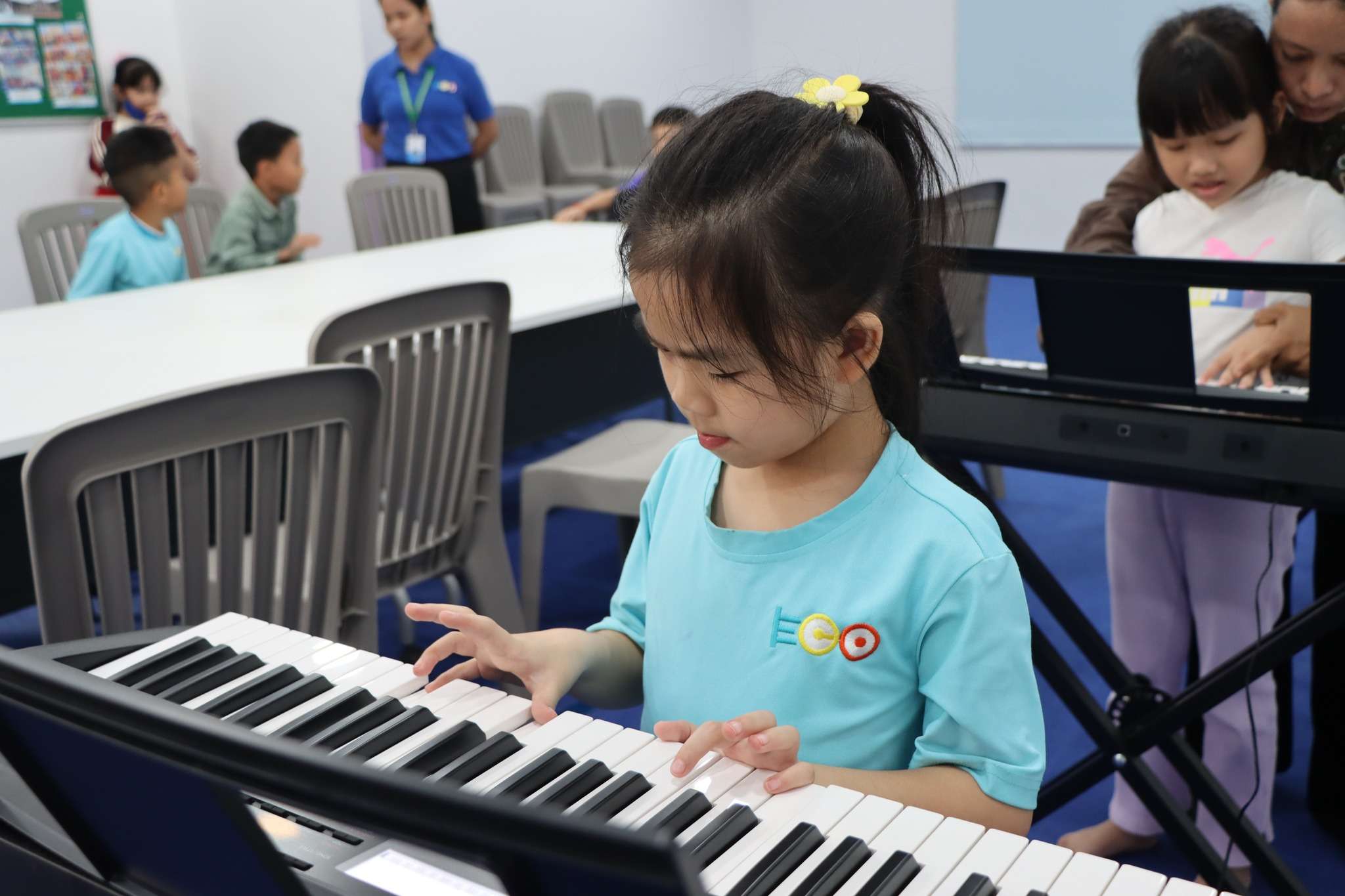 Young student learning piano at Eco International School Phnom Penh