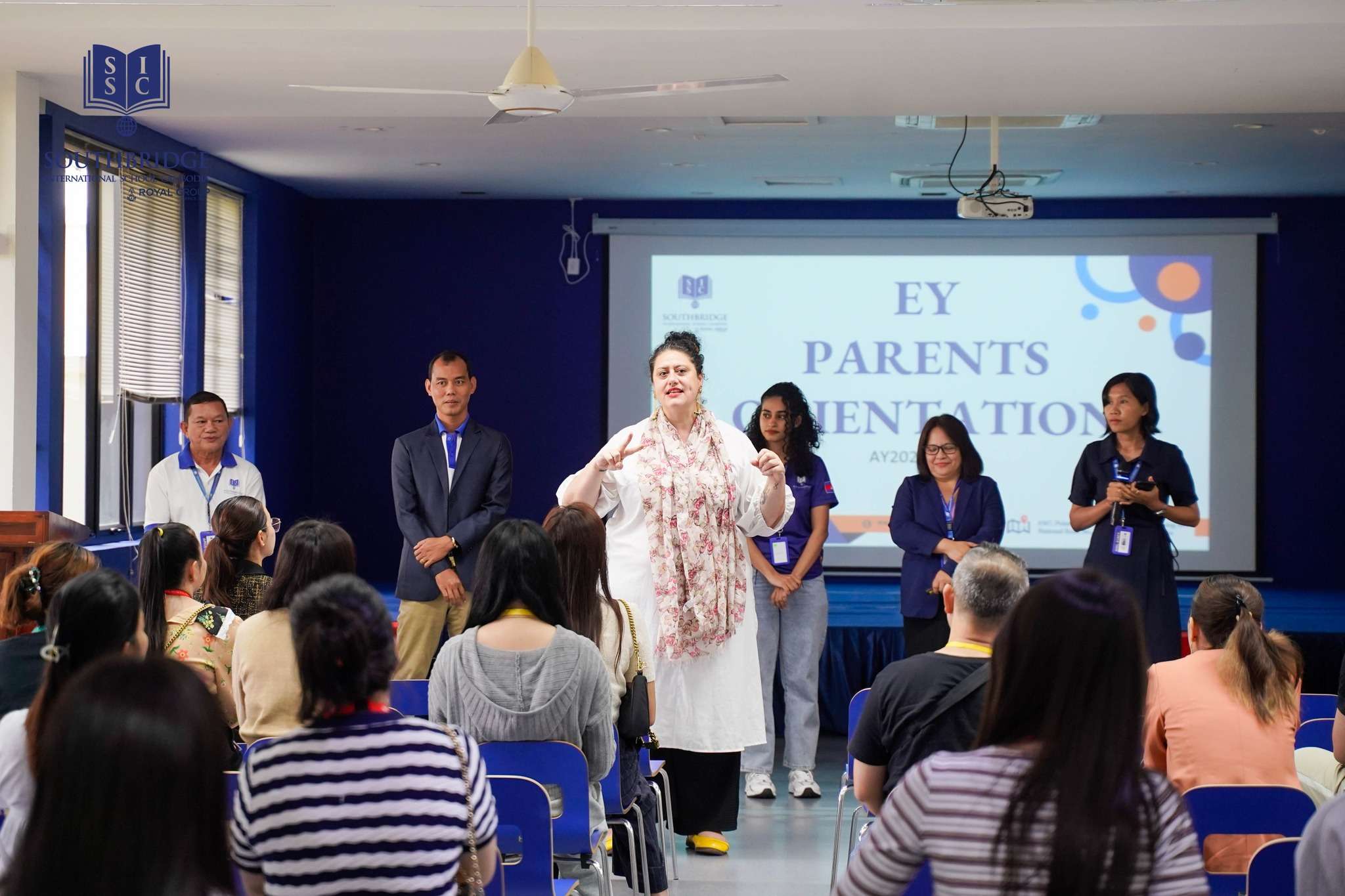 Parent Orientation at Southbridge International School Cambodia with parents, teachers, and school leaders engaging in discussions.