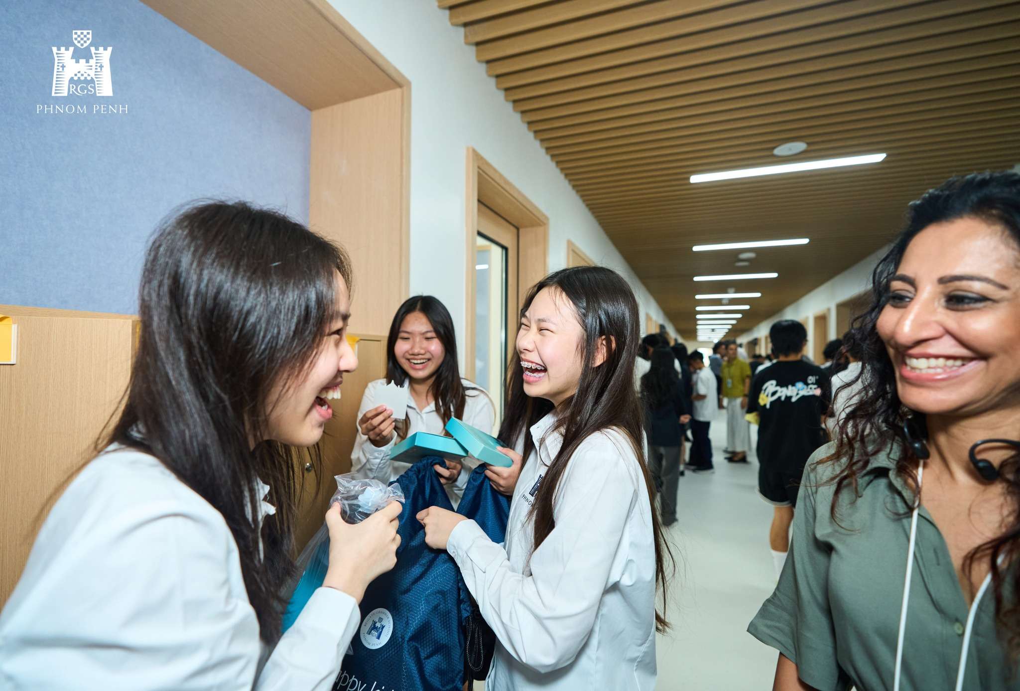 Reigate Grammar School Phnom Penh celebrates its first day with students, parents, and teachers sharing smiles, laughter, and excitement on campus