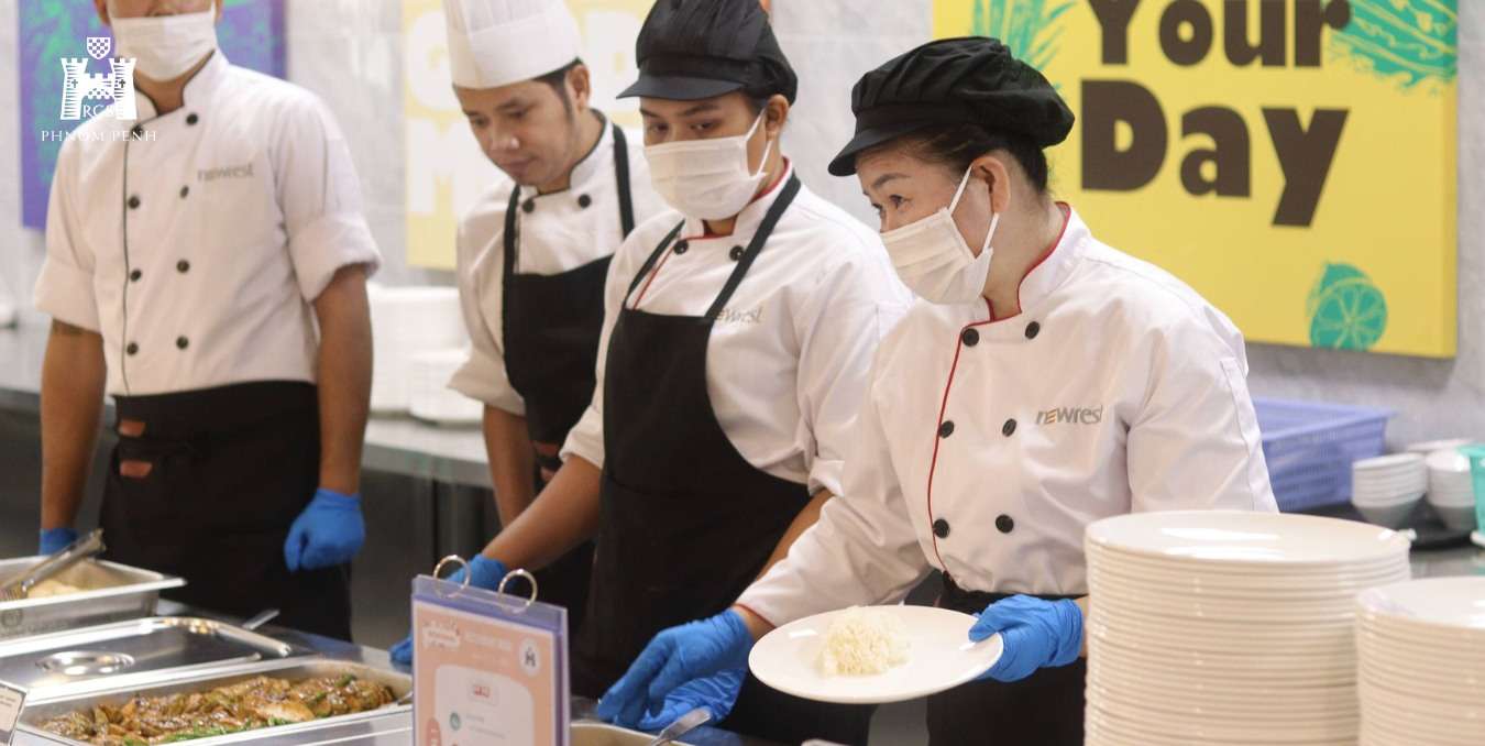 Chefs at Reigate Grammar School Phnom Penh preparing and serving HACCP-certified meals to ensure safety, quality, and nutrition for students.