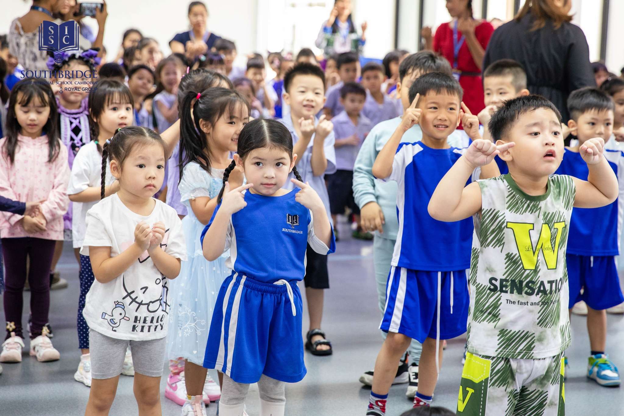 Southbridge International School Cambodia students enjoying Back to School Assembly with dancing, games, and interactive activities