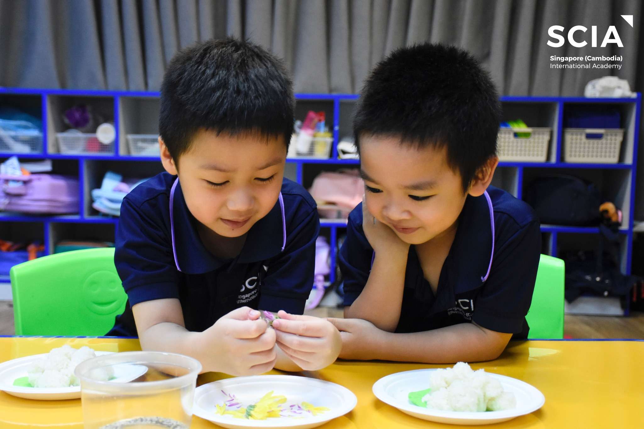 Students at Singapore Cambodia International Academy engaging in Pchum Ben activities, making Baay Ben rice offerings as part of cultural learning
