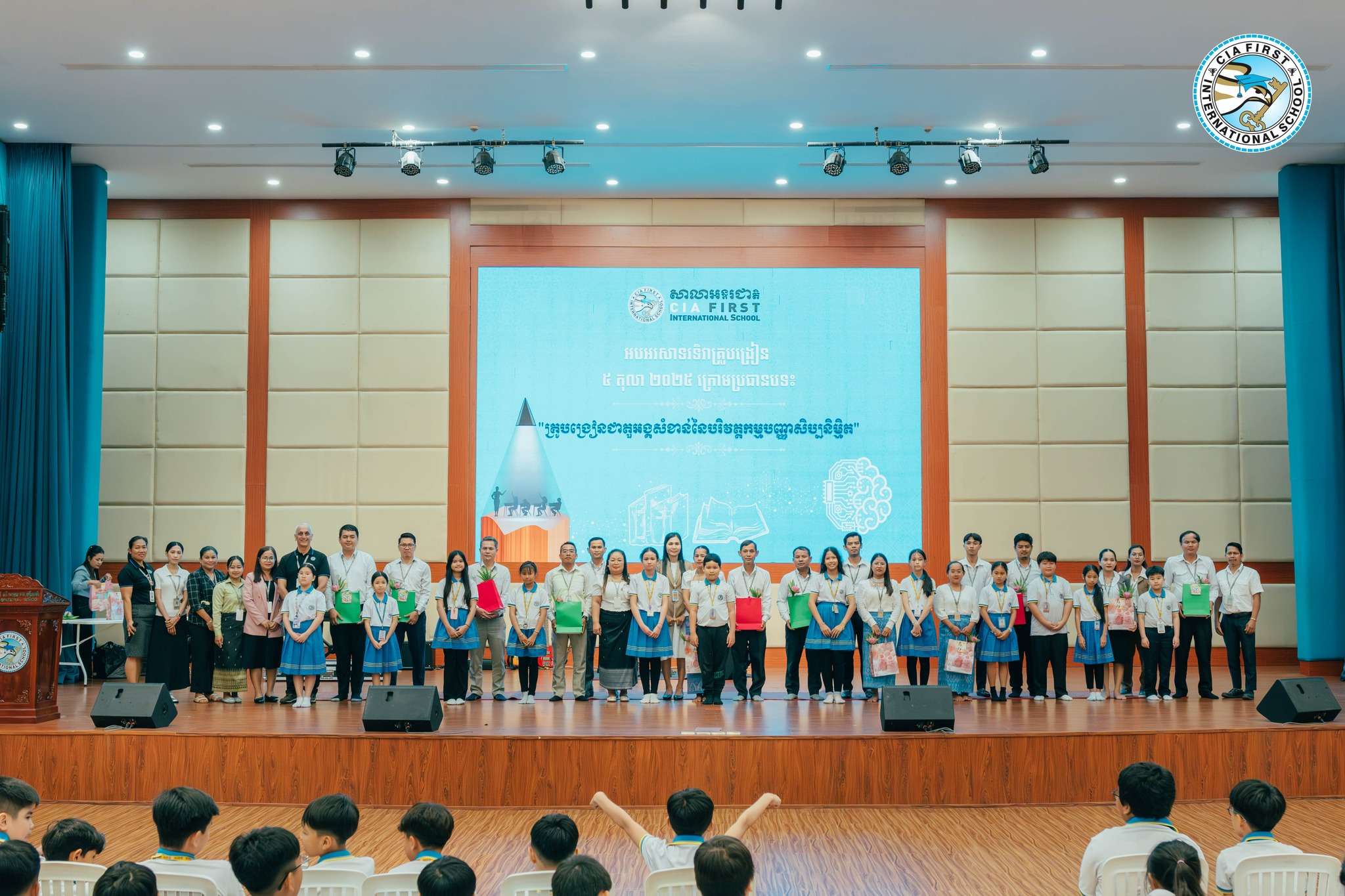 Teachers’ Day celebration at CIA FIRST International School featuring teachers and students on stage expressing gratitude and appreciation.