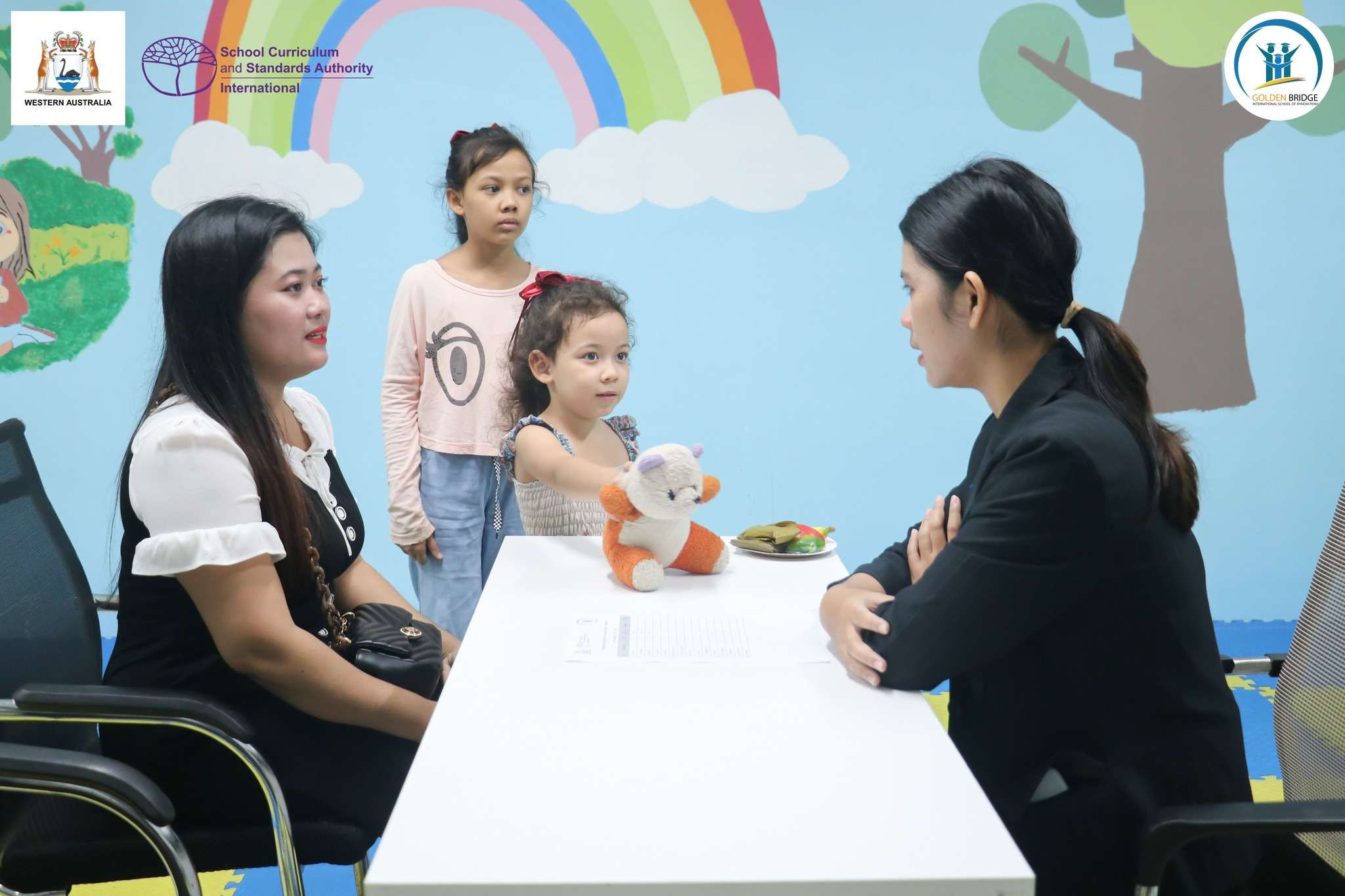 Teachers and parents discussing student progress during the Parent-Teacher Conference at Golden Bridge International School of Phnom Penh, Tuol Kork Campus.