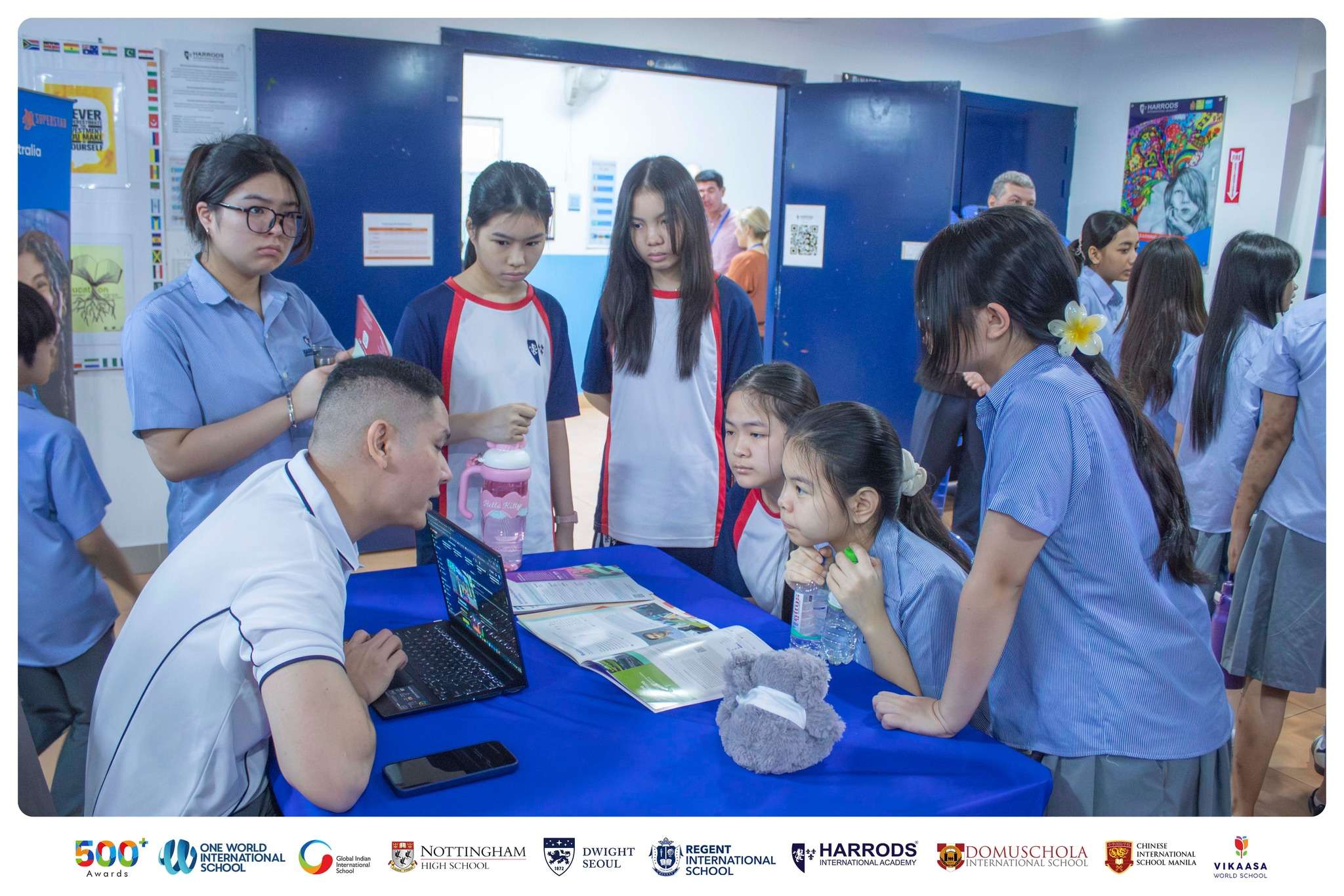 Students at Harrods International Academy engaging with university representatives during the campus fair in Phnom Penh.