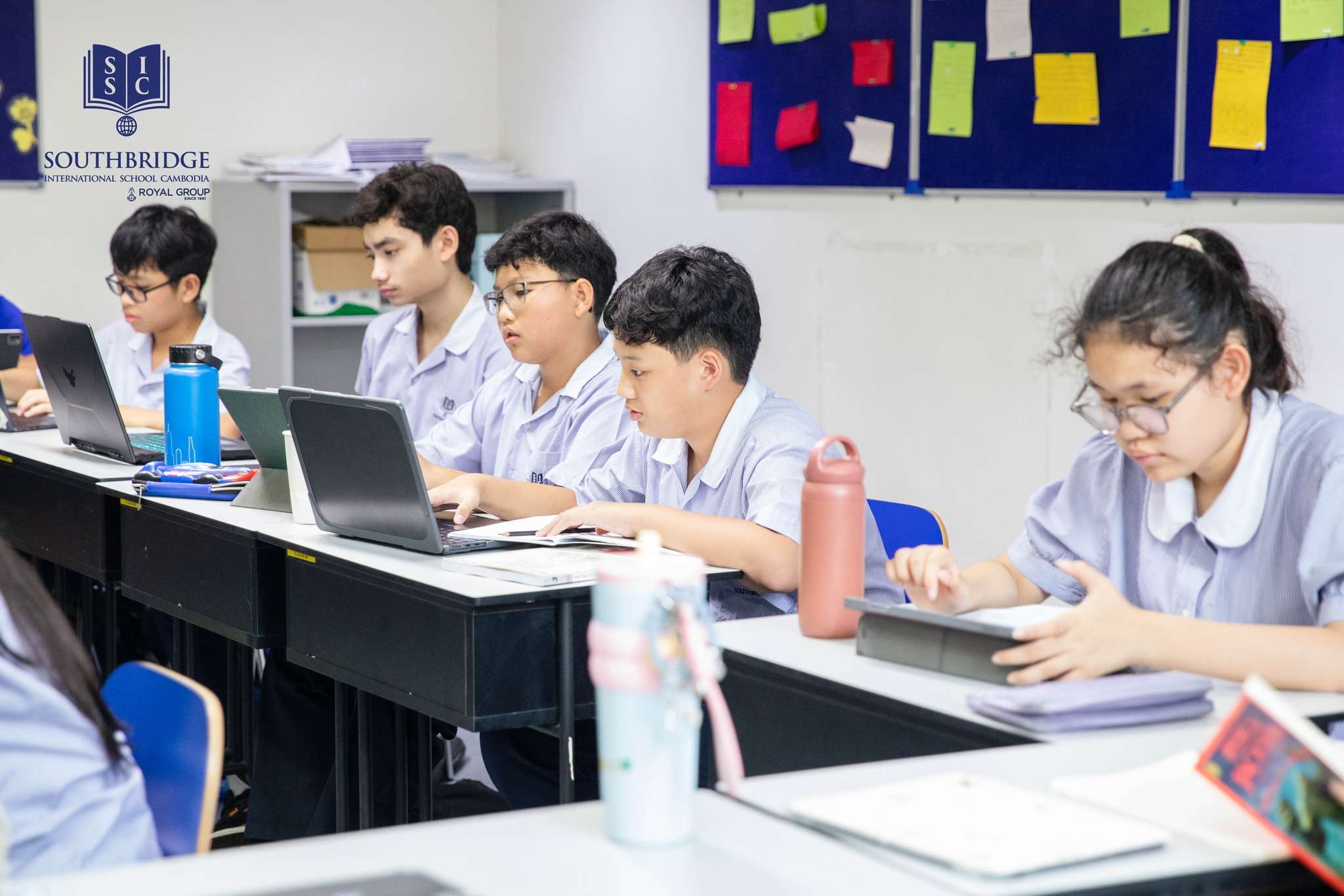 Year 9 students at Southbridge International School Cambodia working together on their Mandarin Chinese class project titled “My Neighbours and Living Environment.”