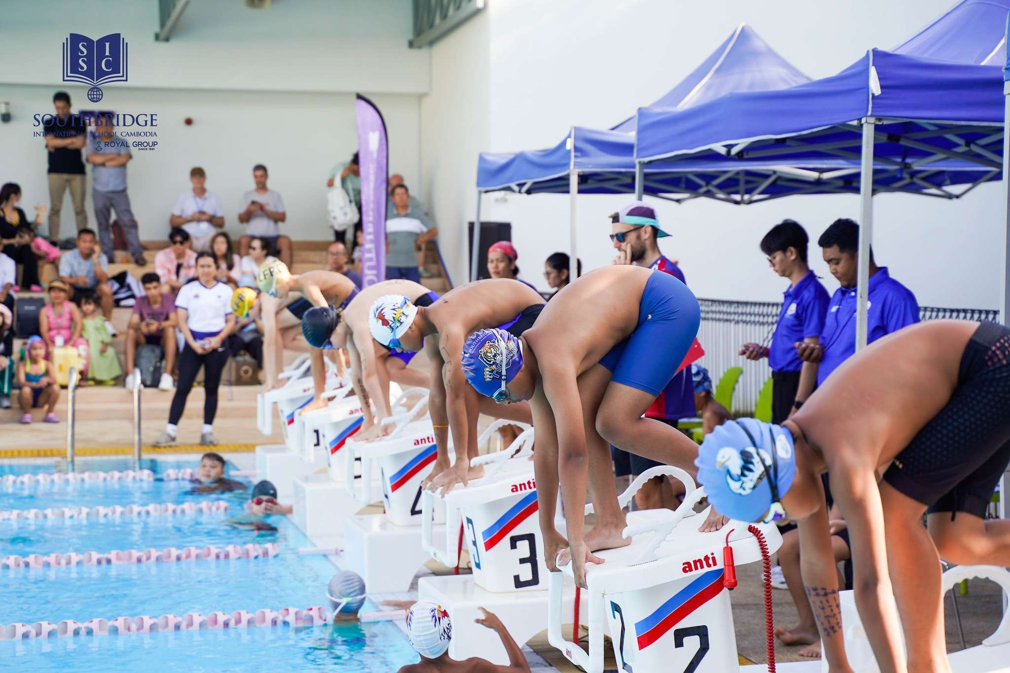 Students competing in Swim Meet 2025 at Southbridge International School Cambodia, showcasing teamwork and youth sports development.