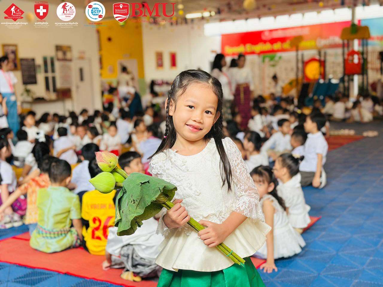 Students of True VISIONS International School of Cambodia celebrating Pchum Ben 2025 with offerings and traditional attire.