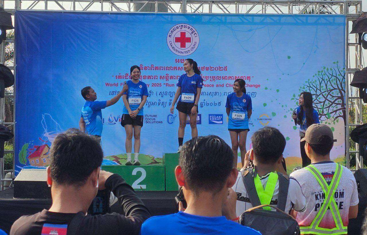 University of Health Sciences students participate in the 2025 Red Cross Humanitarian Marathon in Phnom Penh, promoting health and community spirit.