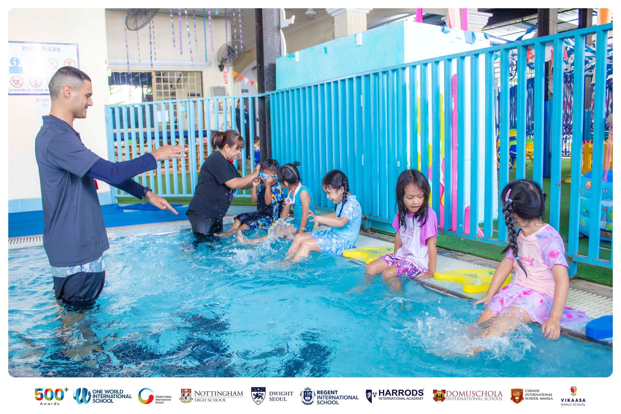 Children participating in Early Years swimming activities at Harrods International Academy.