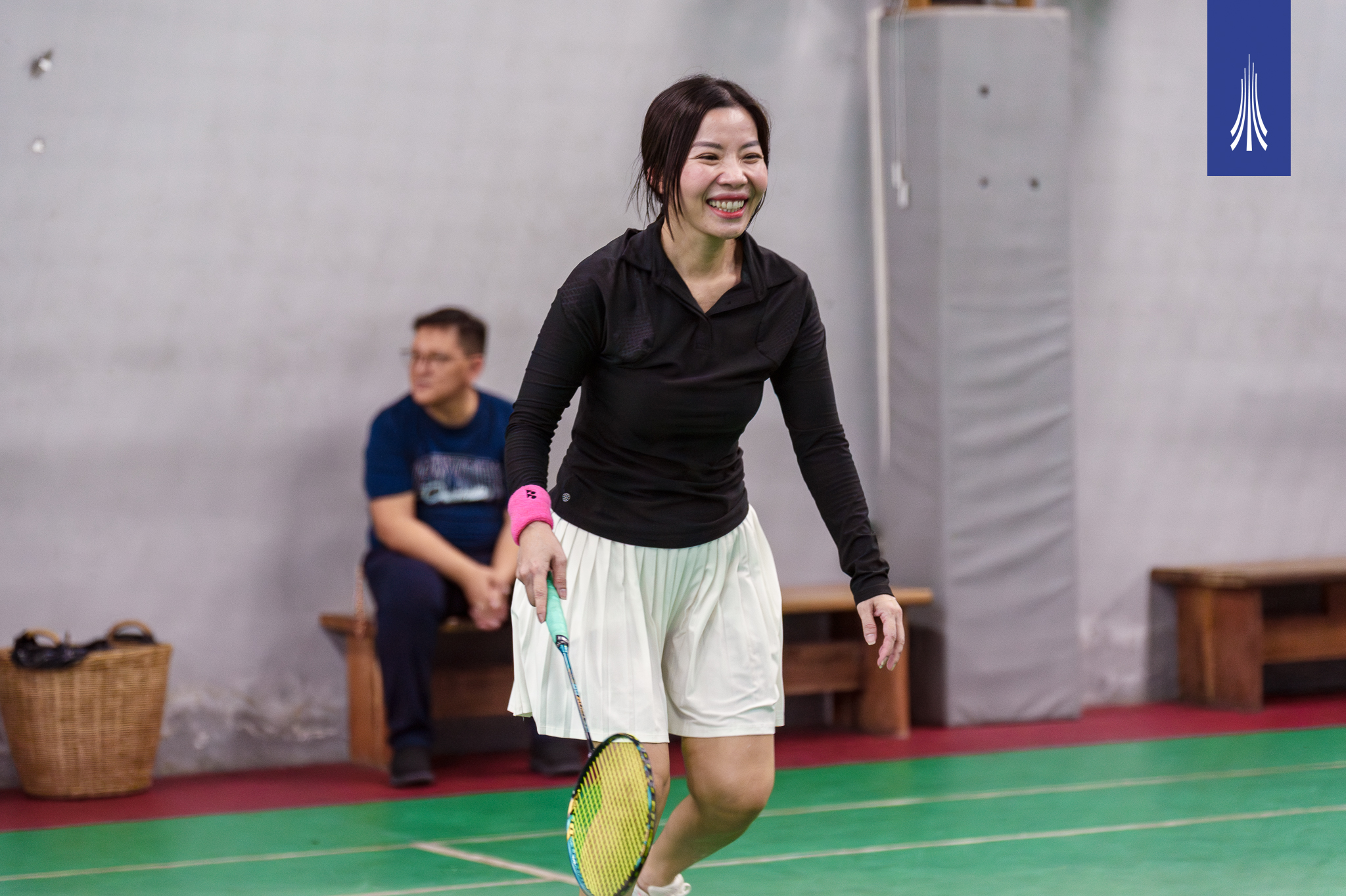 Parents and teachers playing badminton together during PTA weekend at Paragon International School