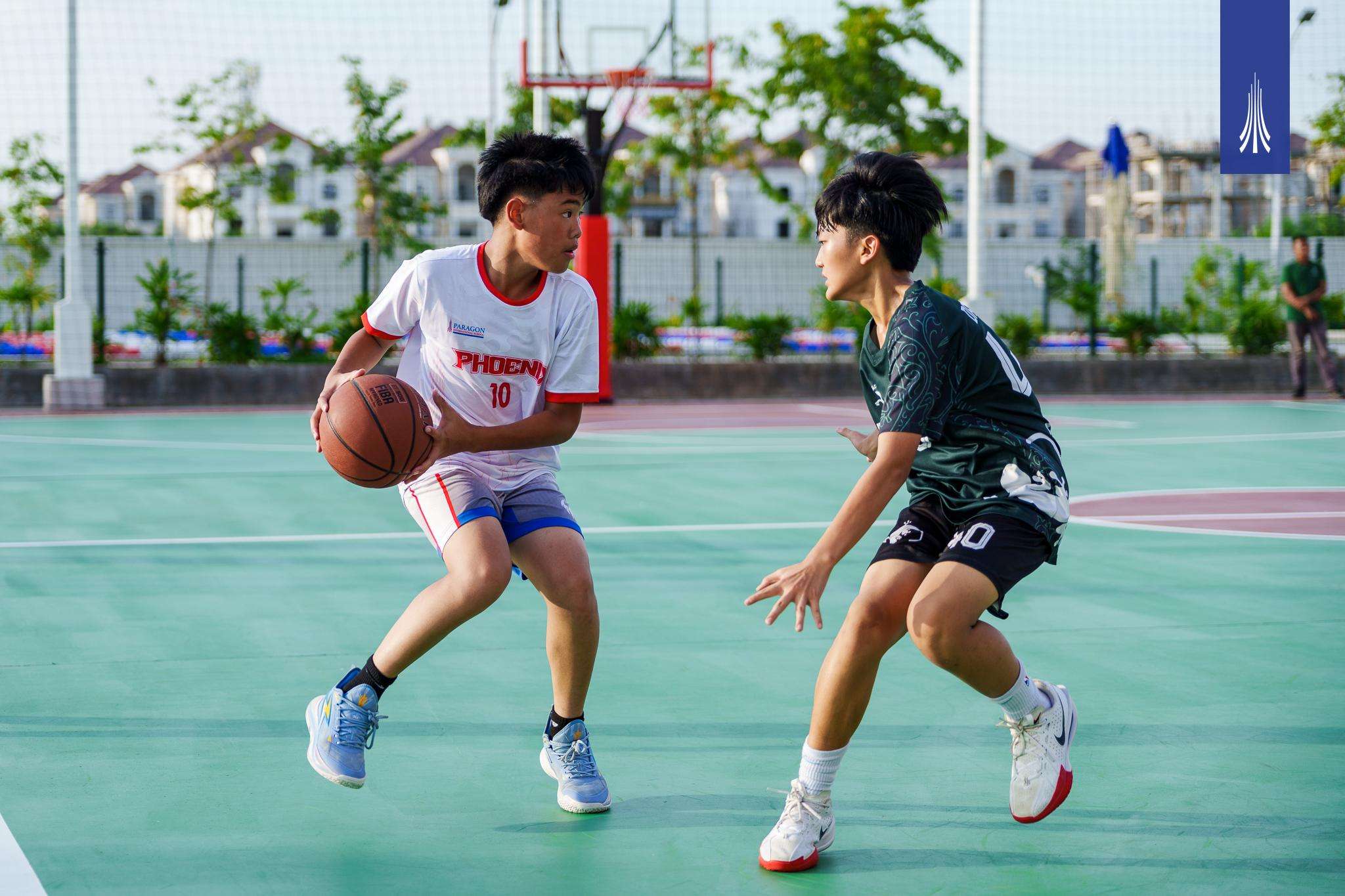 Students of Paragon International School competing in basketball matches, team photos of boys’ and girls’ divisions, and group pictures celebrating their victories.