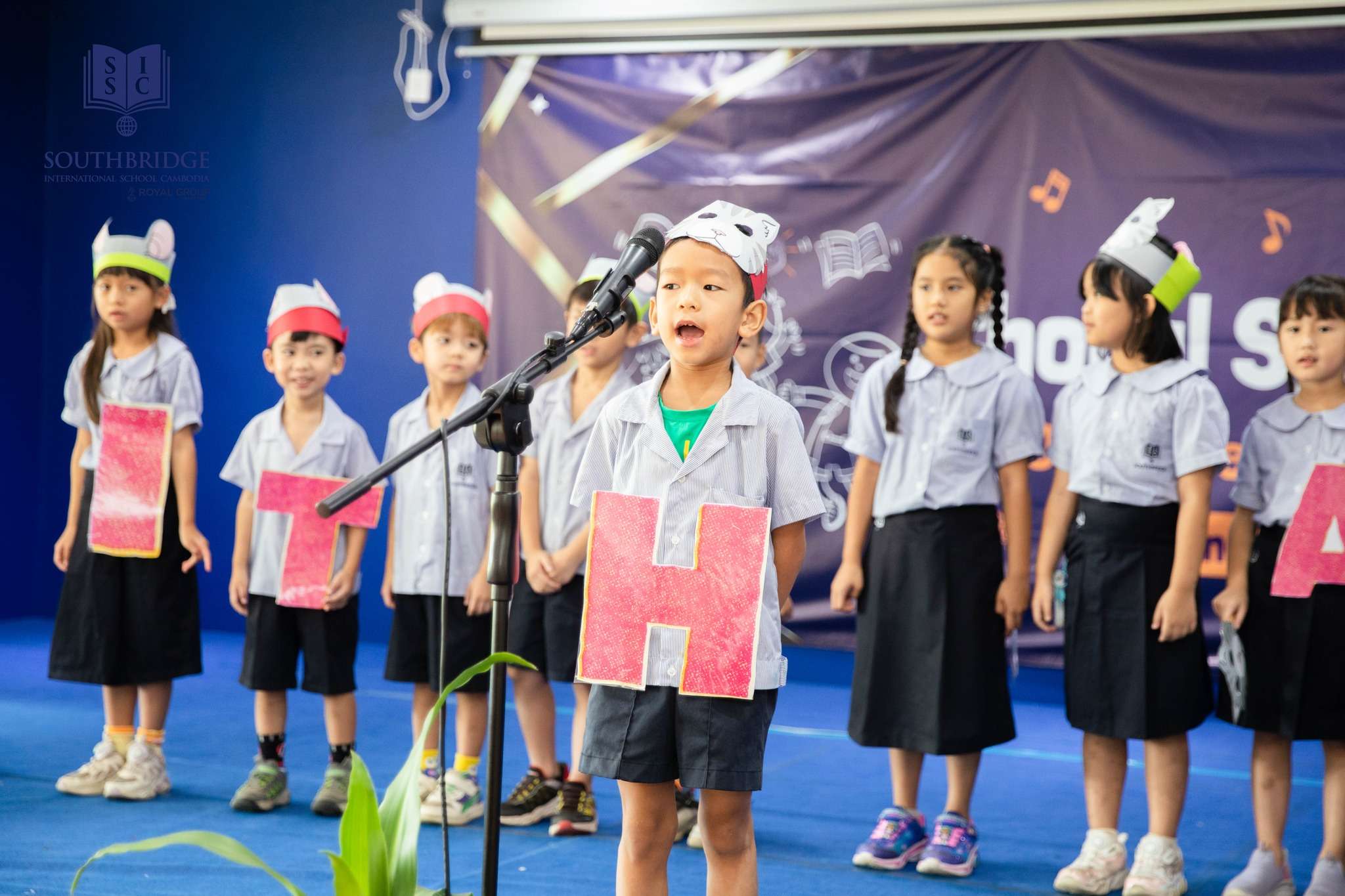 Students of Southbridge International School Cambodia performing in the Primary Years Choral Speaking Event, showcasing confidence, teamwork, and creative expression on stage.