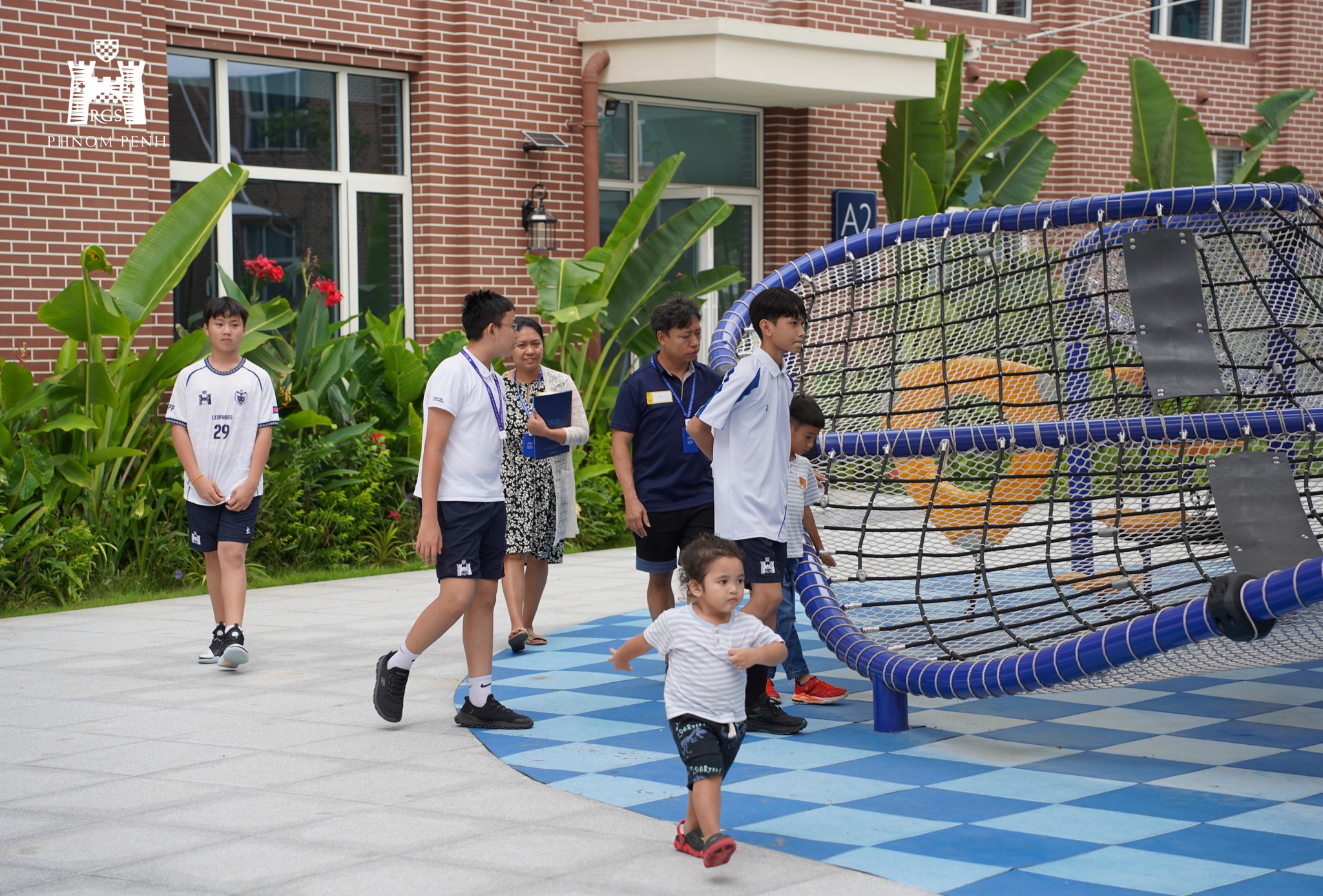 Students and families gathered at Reigate Grammar School Phnom Penh Discover Day, exploring school facilities and engaging with teachers.