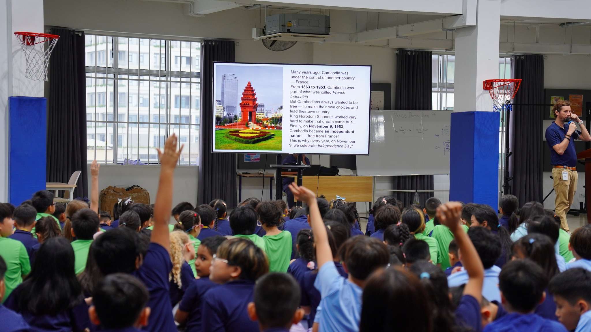 Students of Invictus International School Phnom Penh gathered in a hall watching a presentation about Cambodia’s heritage during the Global Village Series.