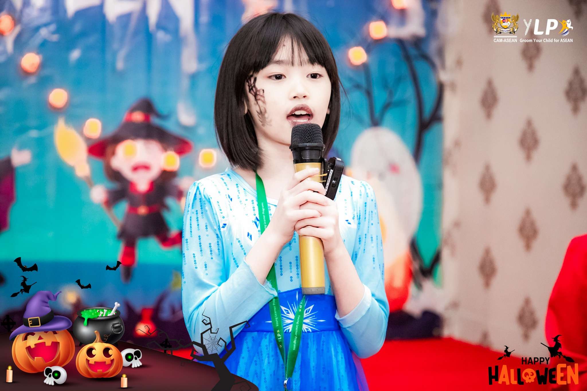 Children in costumes celebrating Halloween at CAM-ASEAN Young Learner Program during stage and storytelling activities