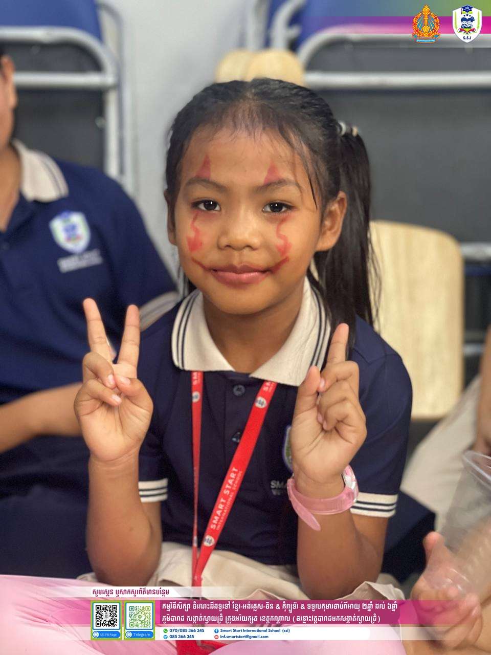 Students at Smart Start International School dressed in Halloween costumes during a school celebration, smiling and posing with teachers.