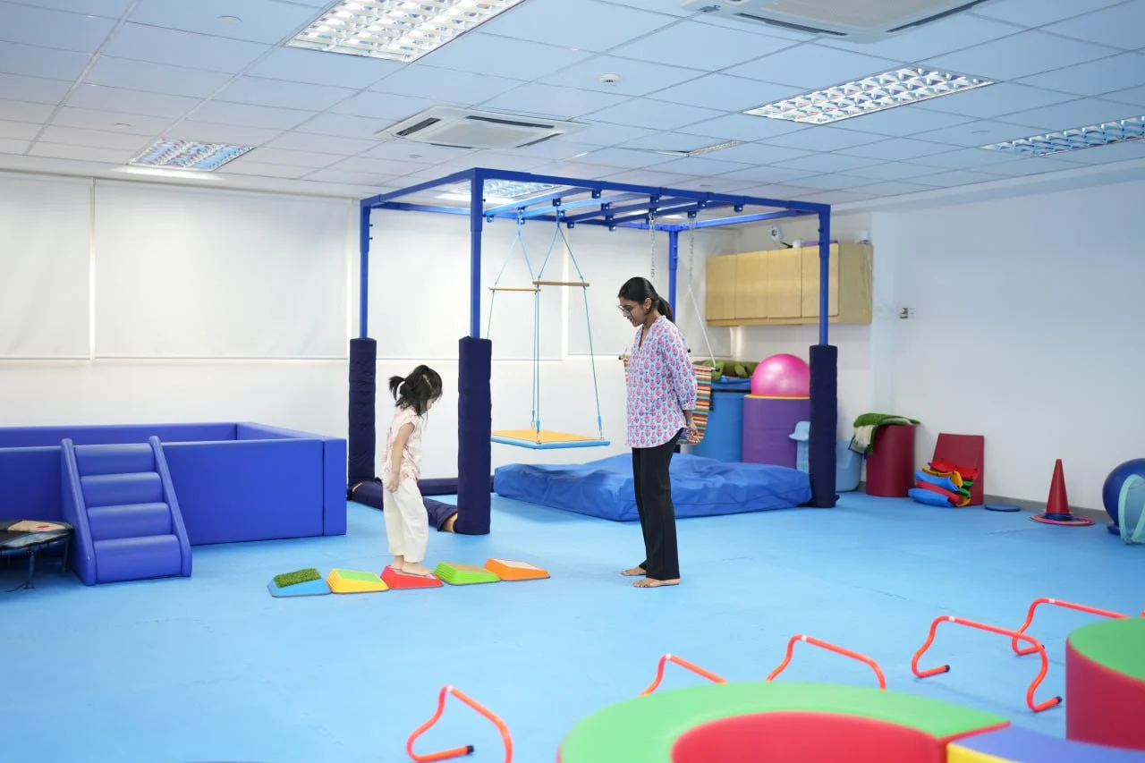Child participating in a structured sensory activity inside a purpose-built sensory room at OrbRom Learning Support Center in Cambodia
