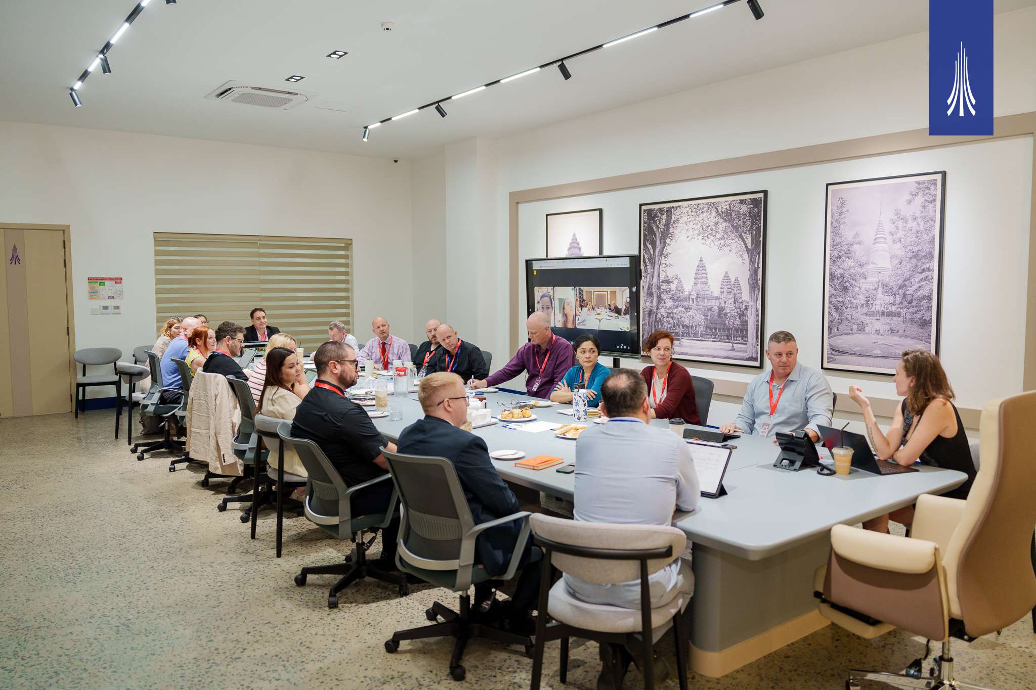 Educators seated in a meeting at Paragon International School discussing safeguarding collaboration through CISSA.