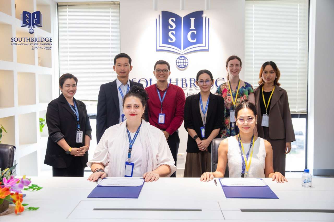 School representatives from Southbridge International School Cambodia and OrbRom Center signing a Memorandum of Understanding to support inclusive education.