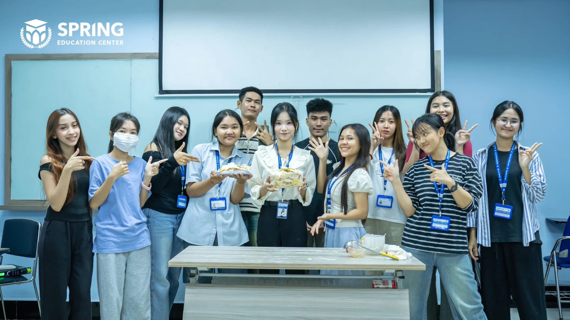 Students and teachers participating in a collaborative learning activity at Spring Education Center in Cambodia