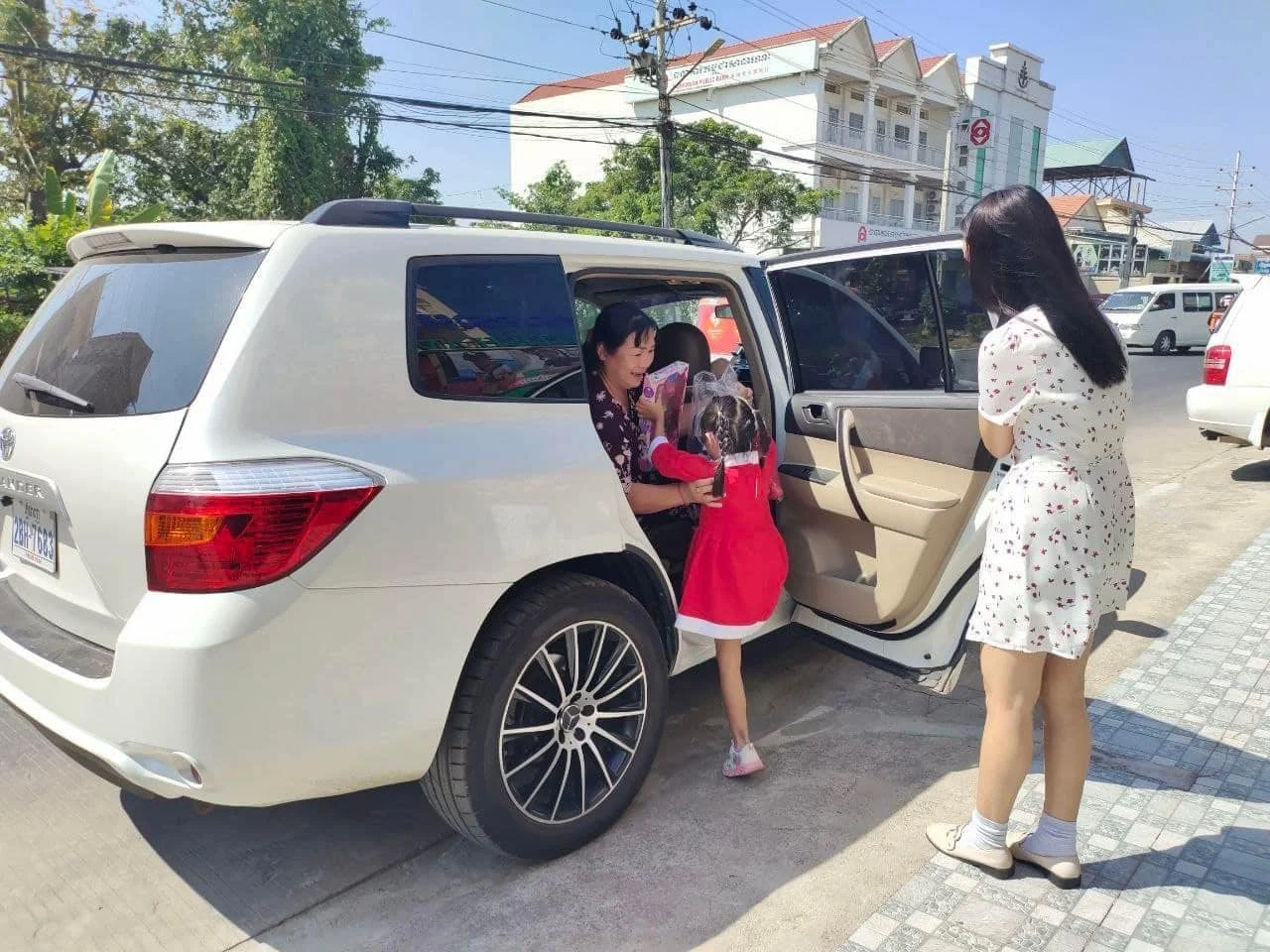 Students arriving safely at British American International School Cambodia with staff support during morning drop-off and transportation supervision
