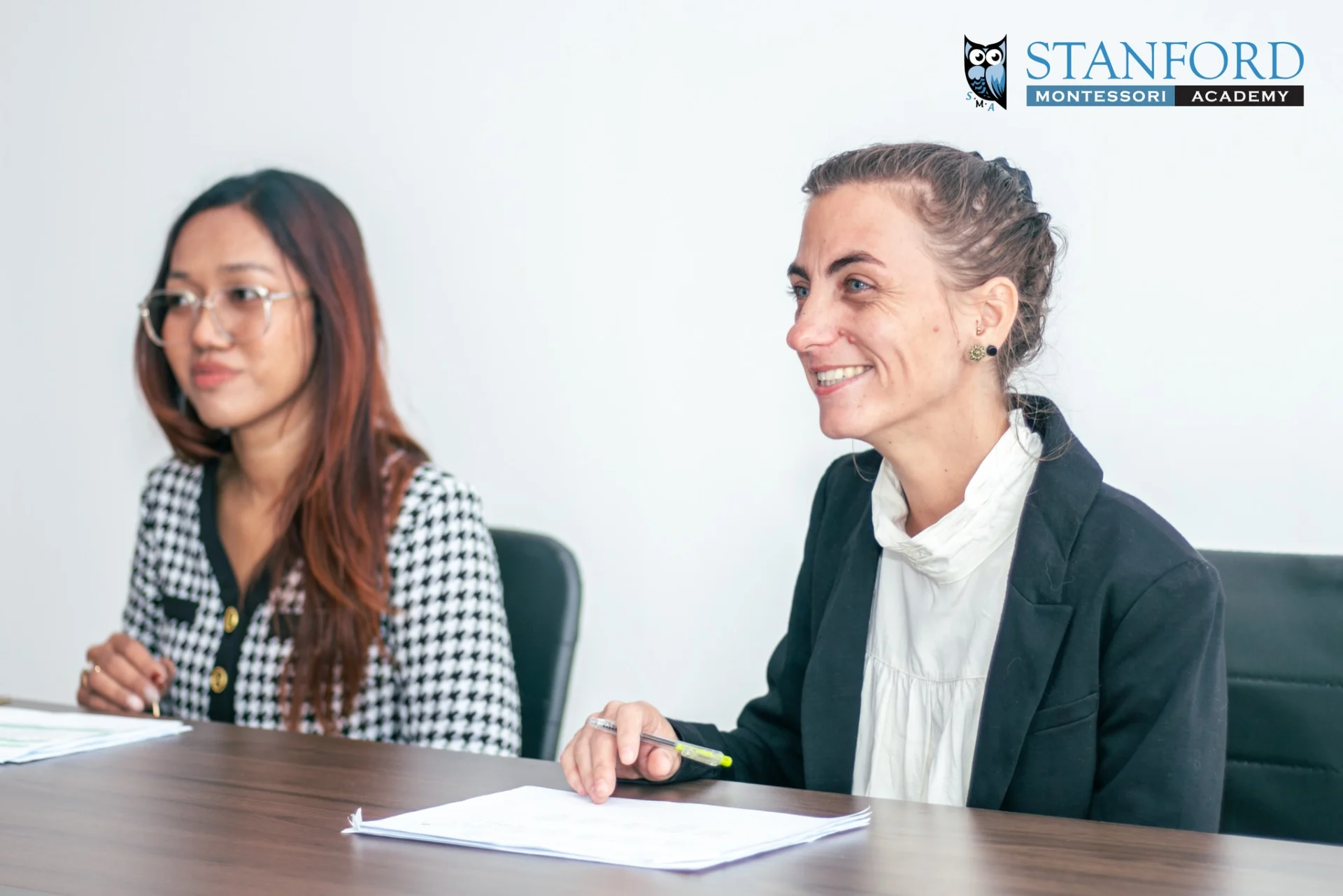Teachers and parents discussing student progress during the Montessori Parent-Teacher Conference at Stanford Montessori Academy in Phnom Penh