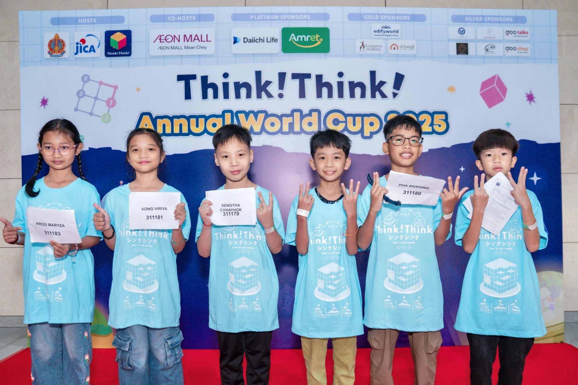 Students and families participating in hands-on problem-solving activities at the ThinkThink Cambodia Annual World Cup event