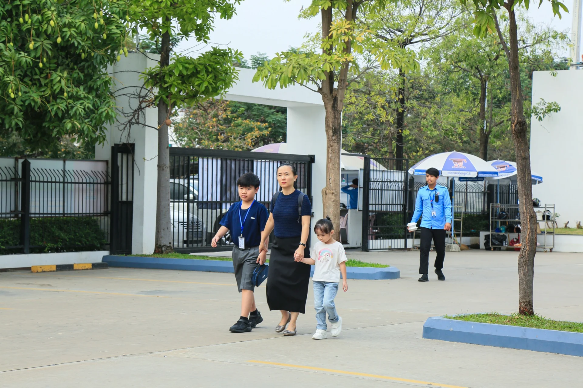 Students and families arriving at Western International School during the World Mathematics Invitational Cambodia preliminary round