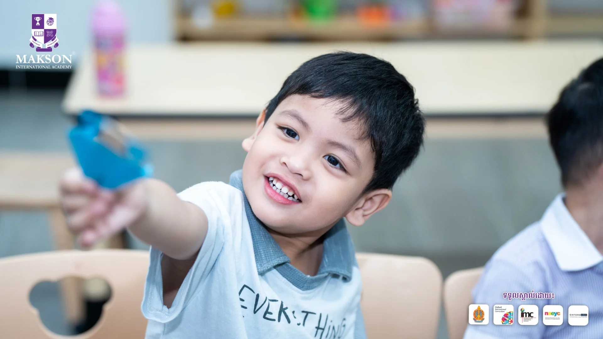 Young students at Makson International Academy participating in a superhero-themed early years classroom activity with creative arts and hands-on learning.