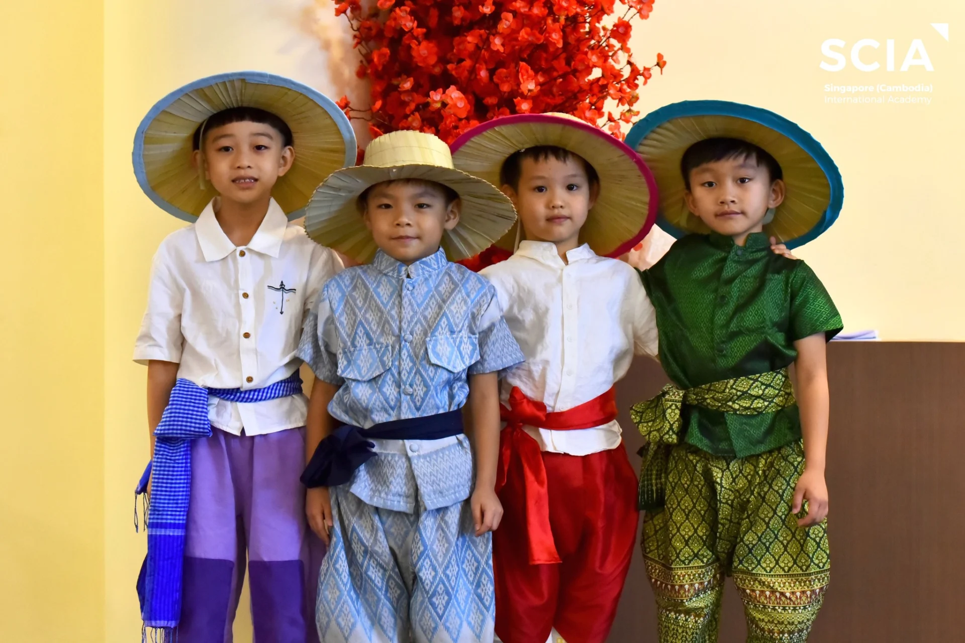Students performing traditional Khmer dance at Singapore Cambodia International Academy during Khmer New Year celebration with audience engagement