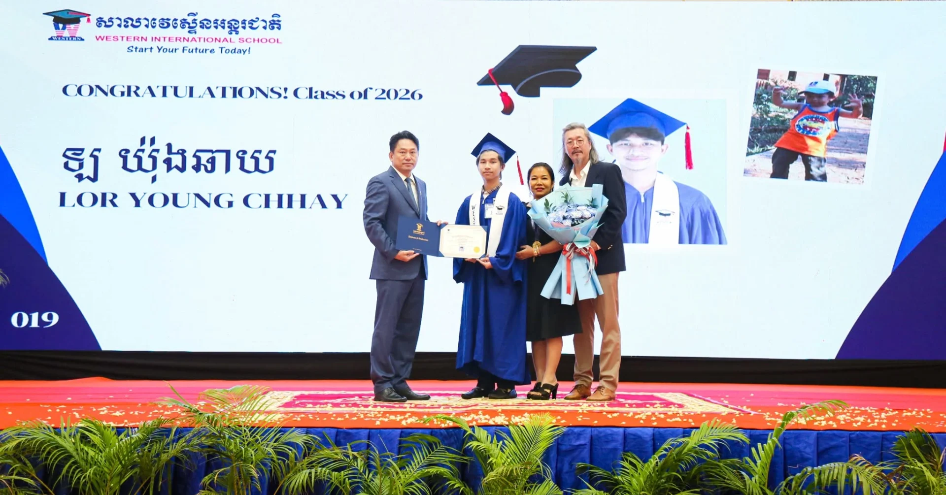 Graduates from Western International School's High School Graduation 2026 ceremony receive diplomas alongside school leaders and family members during the official graduation celebration.